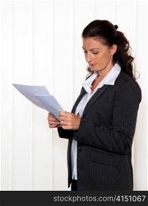 businesswoman reading a letter in the office. message from the lawyer or tax office.