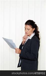 businesswoman reading a letter in the office. message from the lawyer or tax office.