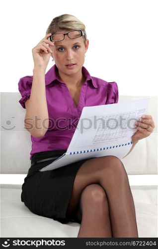Businesswoman reading a report