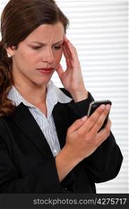 businesswoman receiving bad news on her cell