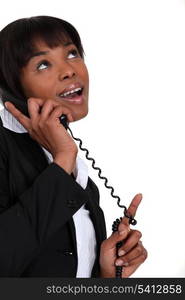 Businesswoman receiving good news over the phone