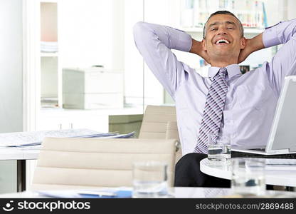 Businesswoman Reclining in Office Chair