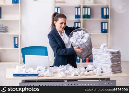Businesswoman rejecting new ideas with lots of papers