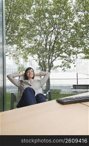 Businesswoman relaxing in an office