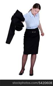 Businesswoman removing her jacket