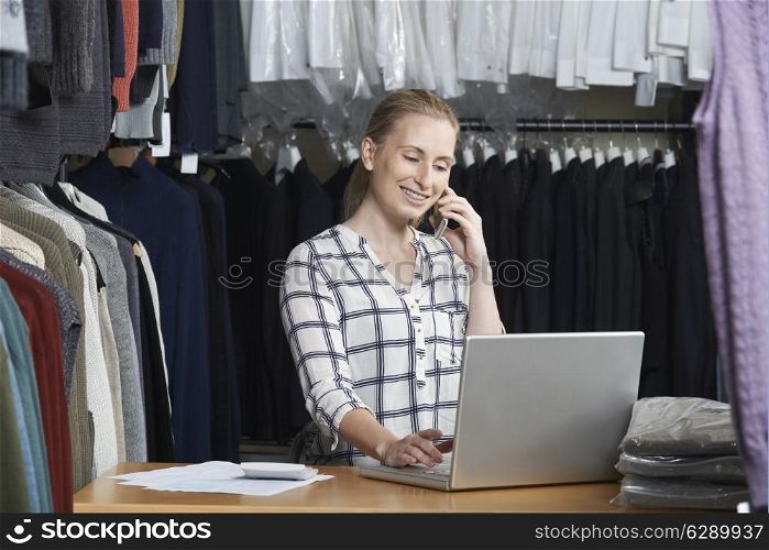 Businesswoman Running On Line Fashion Business On The Phone