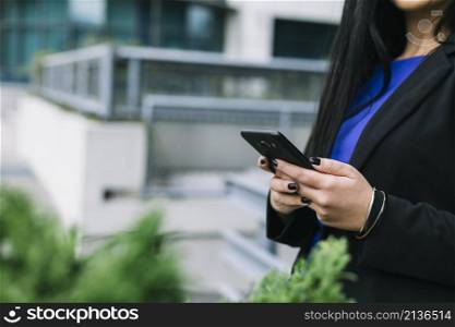 businesswoman s hand using cellphone