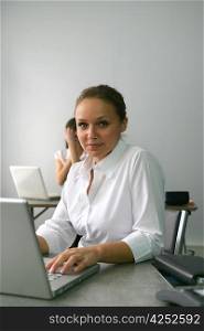 Businesswoman sat at her desk