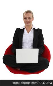 Businesswoman sat cross-legged