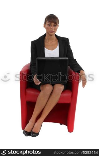 Businesswoman sat in a chair