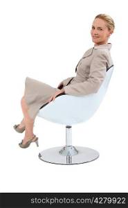 Businesswoman sat in chair