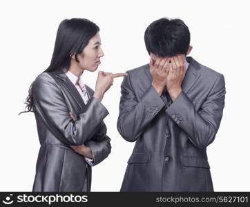 Businesswoman scolding businessman