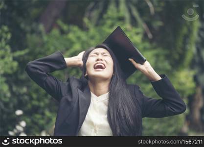 Businesswoman screaming had problem with life crisis and financial problem. Got a fired lost a job. Can?t stand anymore when life turn upside down by the banking crisis.Finance Conceptual Images
