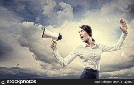 Businesswoman screaming in megaphone. Image of young businesswoman screaming in megaphone
