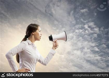 Businesswoman screaming in megaphone. Image of young businesswoman screaming in megaphone