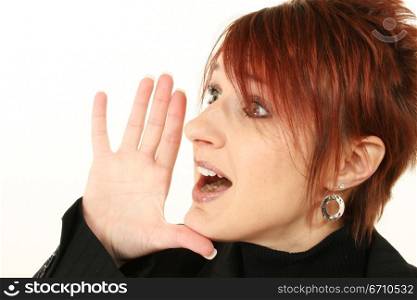 Businesswoman shouting with her hand near her mouth