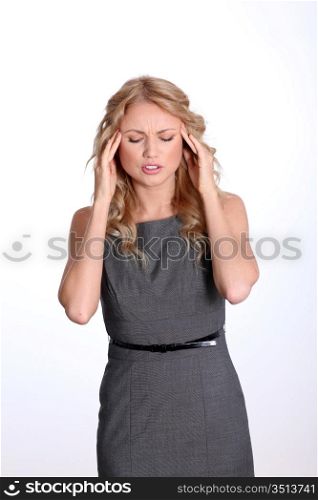 Businesswoman showing migraine pain