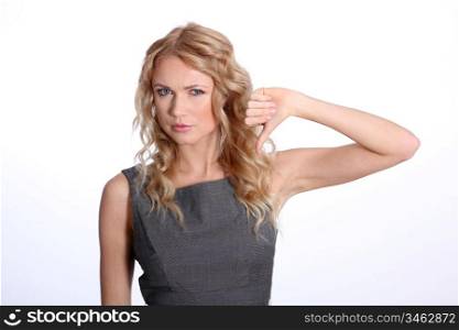 Businesswoman showing thumb down