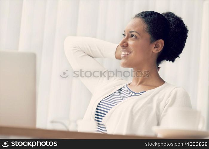 Businesswoman sitting and relaxing in offfice