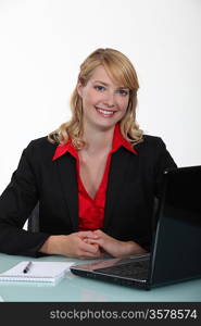 Businesswoman sitting at a laptop