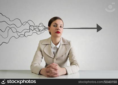 Businesswoman sitting at desk. Happy attractive businesswoman sitting at table in office