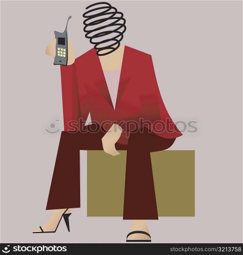 Businesswoman sitting holding a mobile phone