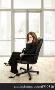 Businesswoman sitting in an office chair
