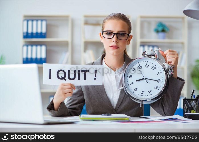 Businesswoman sitting in office with message