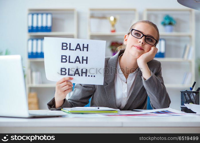 Businesswoman sitting in office with message