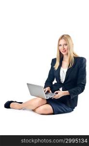 Businesswoman sitting on floor with laptop
