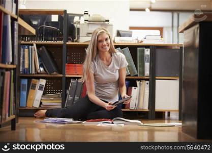 Businesswoman Sitting On Office Floor With Digital Tablet