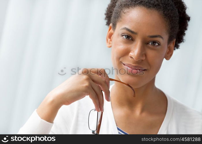 Businesswoman smiling and sitting in offfice