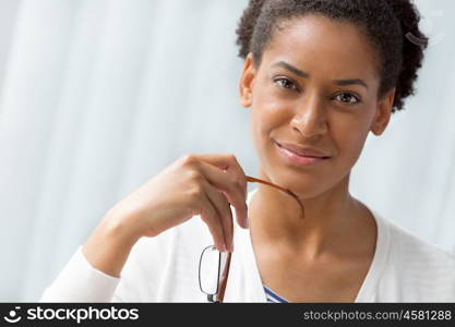 Businesswoman smiling and sitting in offfice