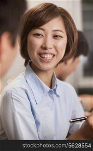 Businesswoman Smiling and Working