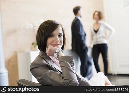 Businesswoman smiling in chair