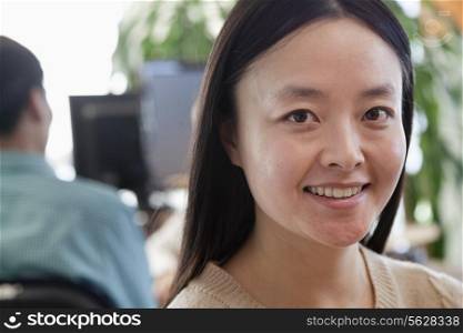 Businesswoman smiling in the office, portrait