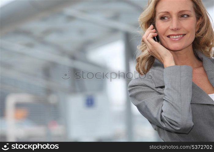 Businesswoman smiling on mobile phone