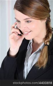 Businesswoman smiling on the phone.