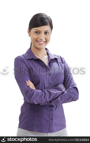 Businesswoman smiling with arms crossed