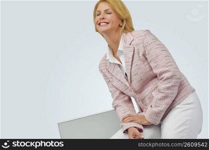 Businesswoman smiling with her eyes closed