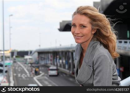 Businesswoman smiling with wind in hair