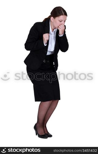 Businesswoman sneezing