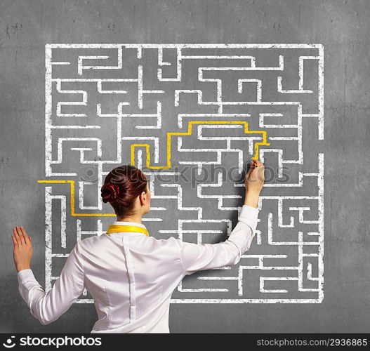 Businesswoman solving maze problem