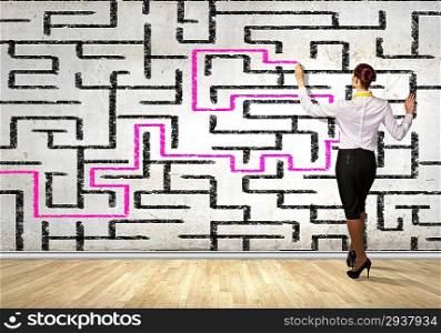 Businesswoman solving maze problem