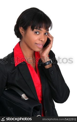 Businesswoman speaking to client over the telephone