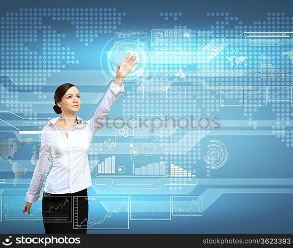 Businesswoman standing and working wth touch screen technology