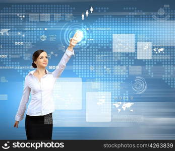 Businesswoman standing and working wth touch screen technology