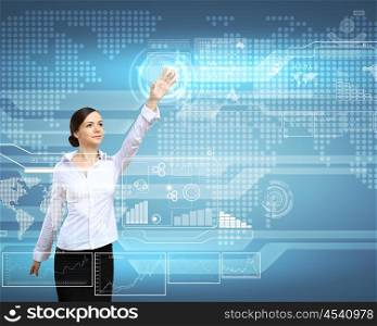 Businesswoman standing and working wth touch screen technology