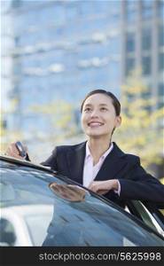 Businesswoman Standing by Car Looking Away
