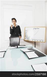 Businesswoman standing in a conference room